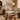 Cozy neutral living room with arched wood bookshelf, cream sofa, and linen curtains