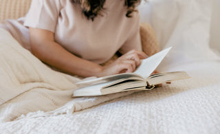 A woman reading in bed 