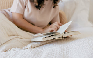 A woman reading in bed 